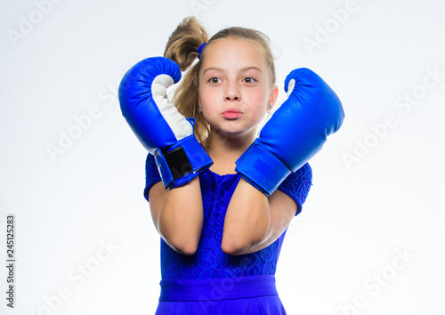 Be strong. Girl child with blue gloves posing on white background. Sport upbringing. Upbringing for leadership and winner. Strong child boxing. Sport and health concept. Boxing sport for female