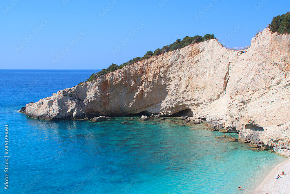 Beautiful clear turquoise water at Katsiki beach against white cliffs, Lefkada, Greece