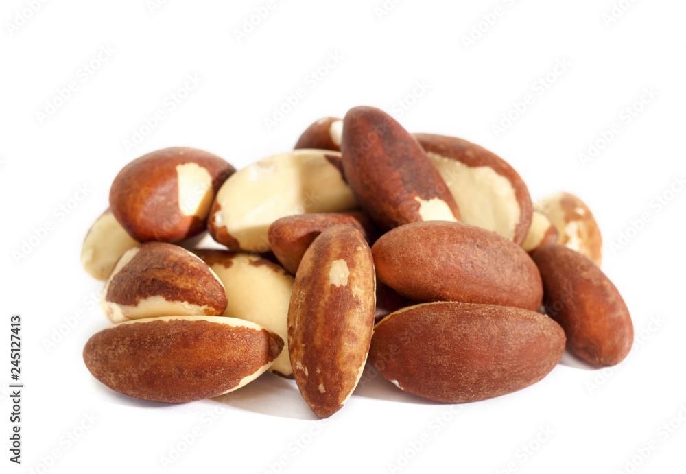 Brazil nut. Bertholletia, of the family Lecythidaceae. High-calorie nut. Isolated on white background. Brazil nut. Bertholletia, of the family Lecythidaceae. High-calorie nut. Isolated on white background.