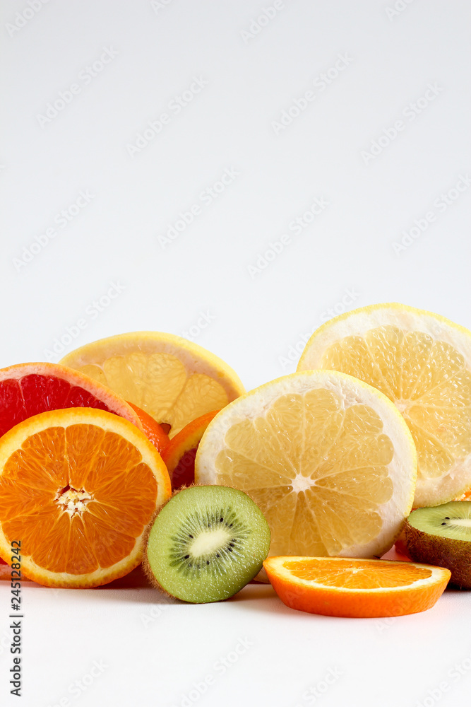 Layers of sliced fruits - kiwi, orange and grapefruits, close up Layers of sliced fruits - kiwi, orange and grapefruits, close up
