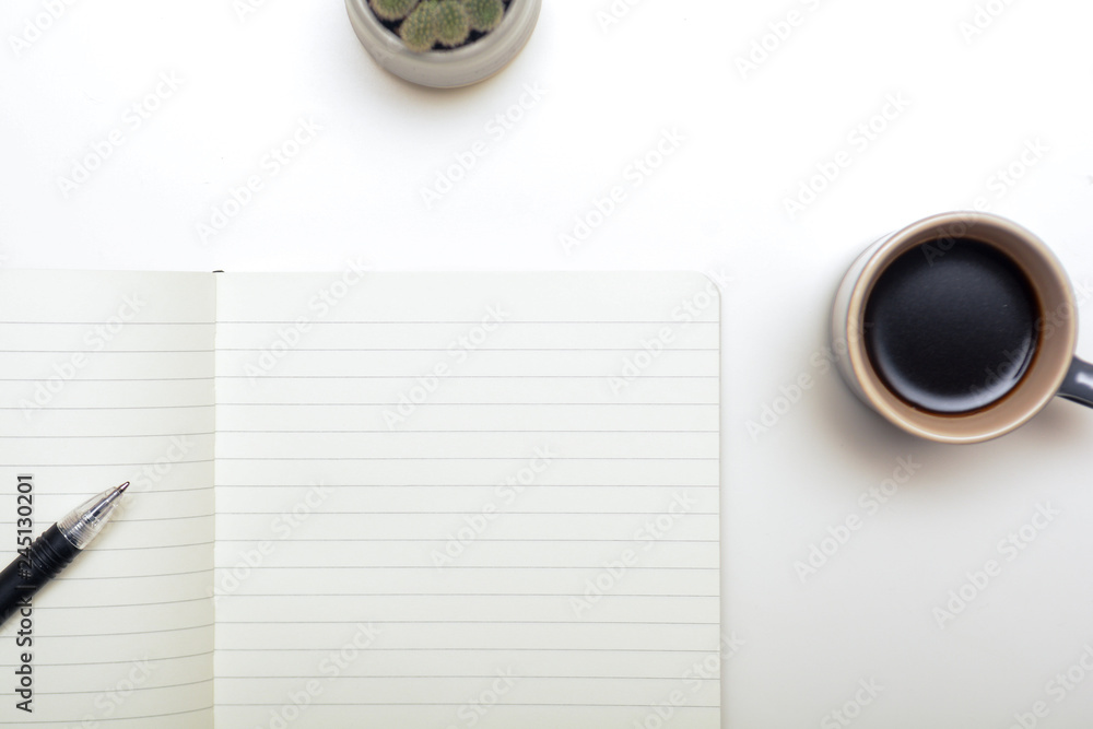 Office desk with note paper left blank to add your own message Office desk with note paper left blank to add your own message