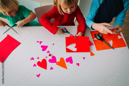 kids making hearts from paper, prepare for valentine day