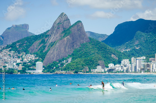 Photography Scenic view of Ipanema Beach on a bright summer morning with smooth waves rollin