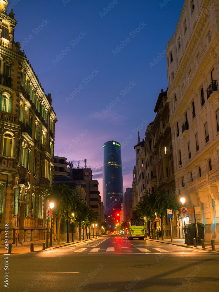 Naklejka premium BILBAO, SPAIN - JUlY 08: Iberdrola Tower at sunset in Bilbao, Spain on July 08, 2018. The 165m tower was inaugurated in 2012 and is the highest building in Bilbao and the Basque Country.