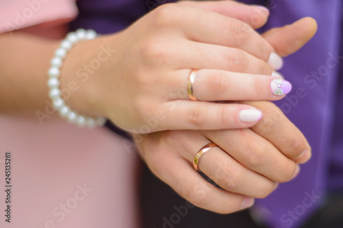 wedding: hands of newlyweds with rings close