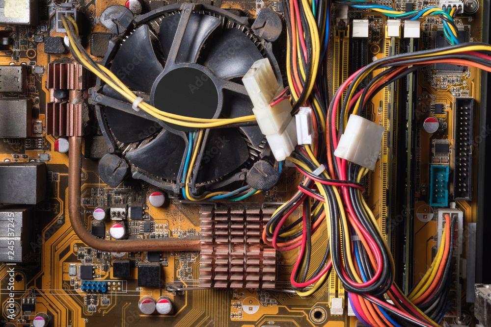 Computer chip in details of the old computer in dust. Motherboard, cooler,  close up Stock Photo | Adobe Stock