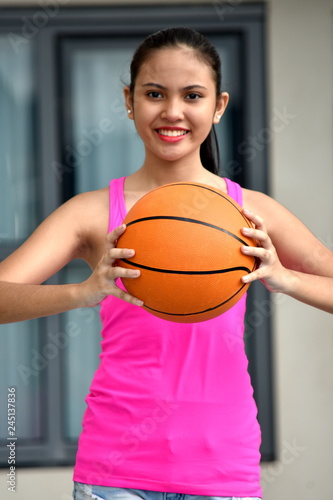 Smiling Athletic Asian Female Basketball Player
