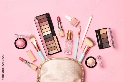 Obraz  professional makeup tools. Makeup products on a colored background top view. A set of various products for makeup.