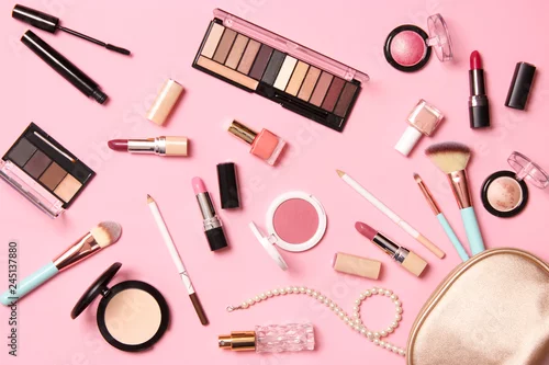 Obraz  professional makeup tools. Makeup products on a colored background top view. A set of various products for makeup.