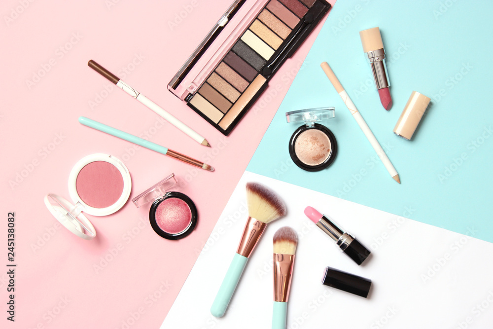  professional makeup tools. Makeup products on a colored background top view. A set of various products for makeup. - obrazy, fototapety, plakaty 
