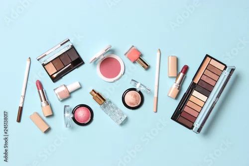 Fototapeta na wymiar  professional makeup tools. Makeup products on a colored background top view. A set of various products for makeup.