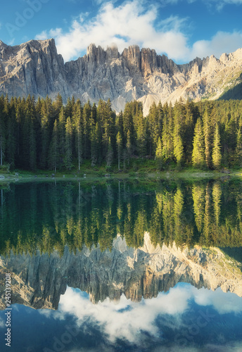 Fototapeta Naklejka Na Ścianę i Meble -  Lago di Carezza lake, Dolomite alps, Italy. Mountains and forest reflection on the water surface. Natural landscape in the Dolomite Alps, Italy. Dolomite alp - image