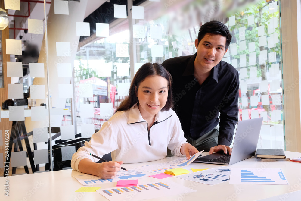 Startup business, Portrait shot of young man and woman working with finance data paper. Startup business, Portrait shot of young man and woman working with finance data paper.