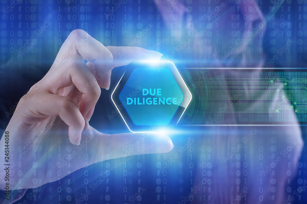 The concept of business, technology, the Internet and the network. A young entrepreneur working on a virtual screen of the future and sees the inscription: Due diligence The concept of business, technology, the Internet and the network. A young entrepreneur working on a virtual screen of the future and sees the inscription: Due diligence