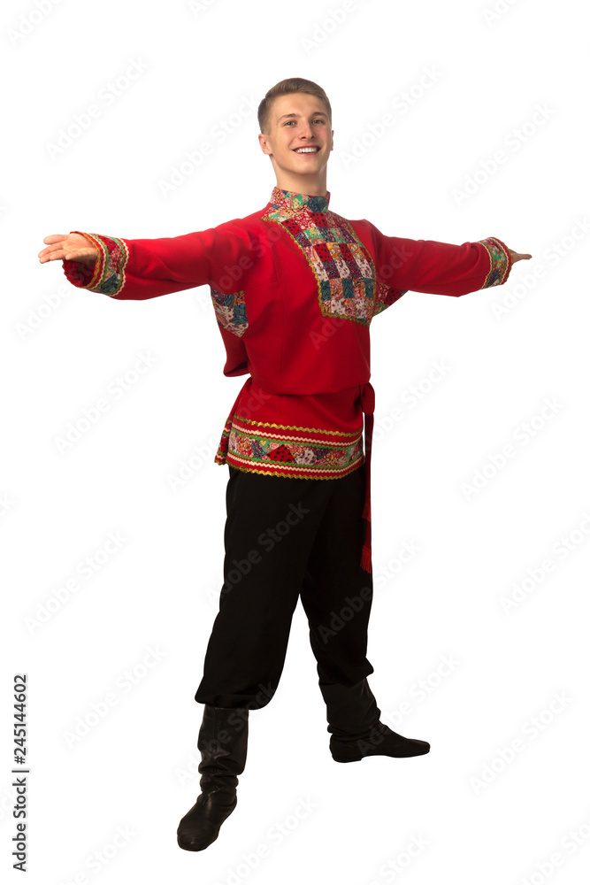 Attractive russian guy dancing in folk costume isolated on white Attractive russian guy dancing in folk costume isolated on white