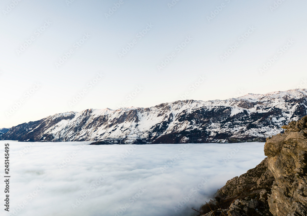 fog and cloud snow mountain valley landscape. View of Aramo Mountain, Asturias, Spain.