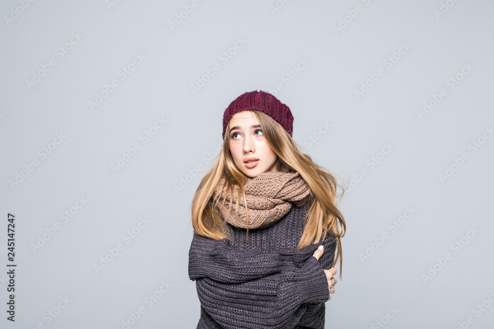Winter portrait smiling girl wearing warm clothes isolated on grey background