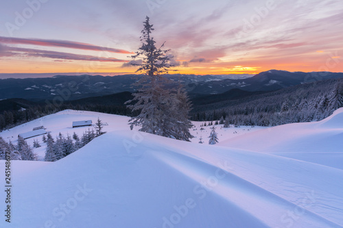 Colorful winter dawn on the mountain valleys in the Ukrainian Carpathian Mountains. © reme80