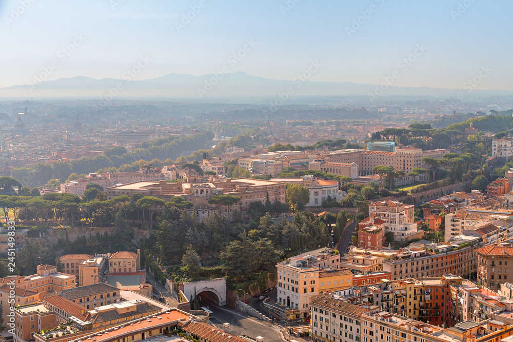 Panorama of Rome with tunnel and old houses from above in sunny weather, Italy, Europe