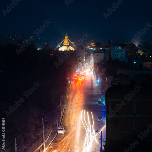 Boudhanath stupa and Boudha Road at night in Nepal. 