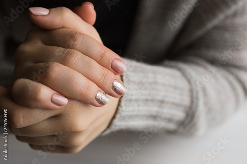 Female hands with manicure and pink polished nails