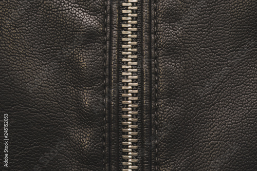 Zipper, lightning on black leather