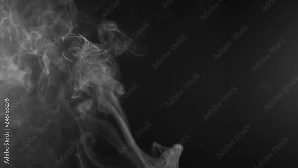 White steam rises light on black background. White steam rises light on black background.