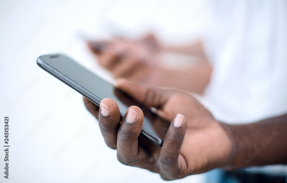 close up. smartphone in the hand of a businessman close up. smartphone in the hand of a businessman
