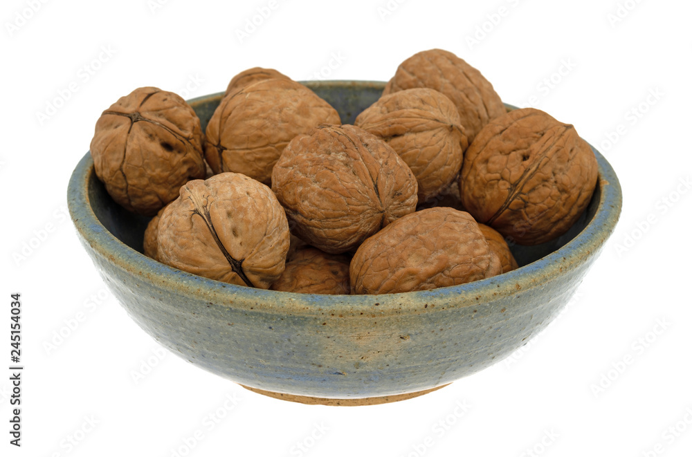 Bowl of walnuts isolated on a white background side view Bowl of walnuts isolated on a white background side view
