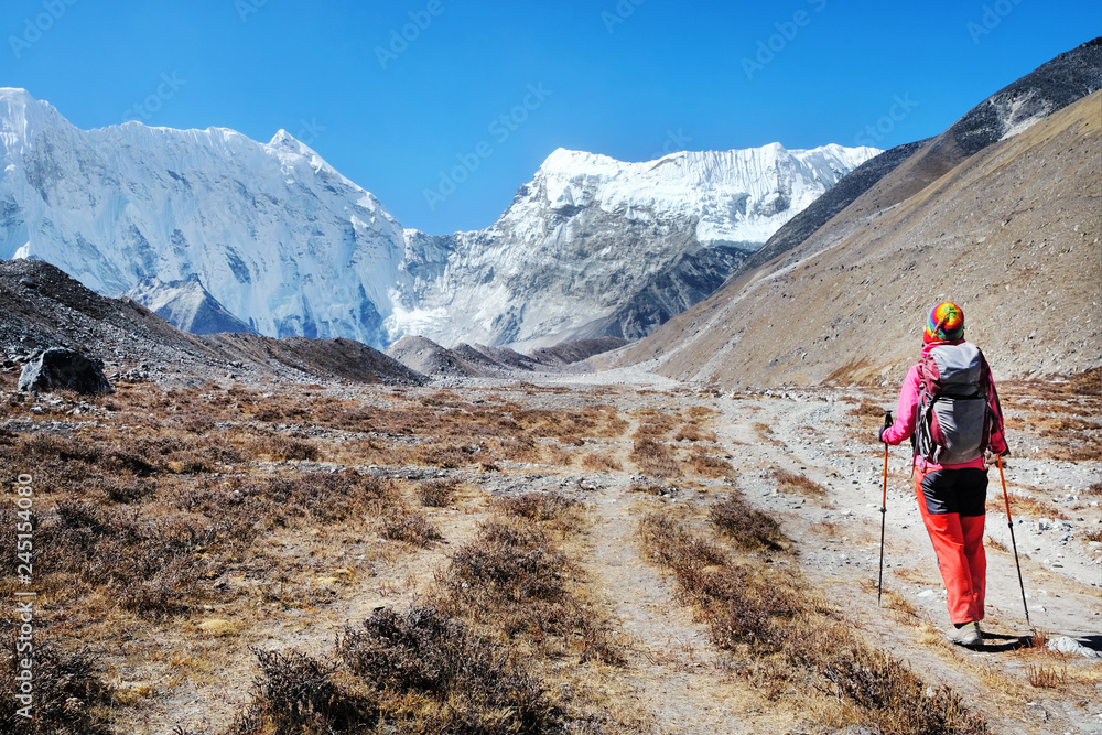 Hiker walking in the mountains, freedom and happiness, achievement in mountains. Himalayas, Everest Base Camp trek, Nepa