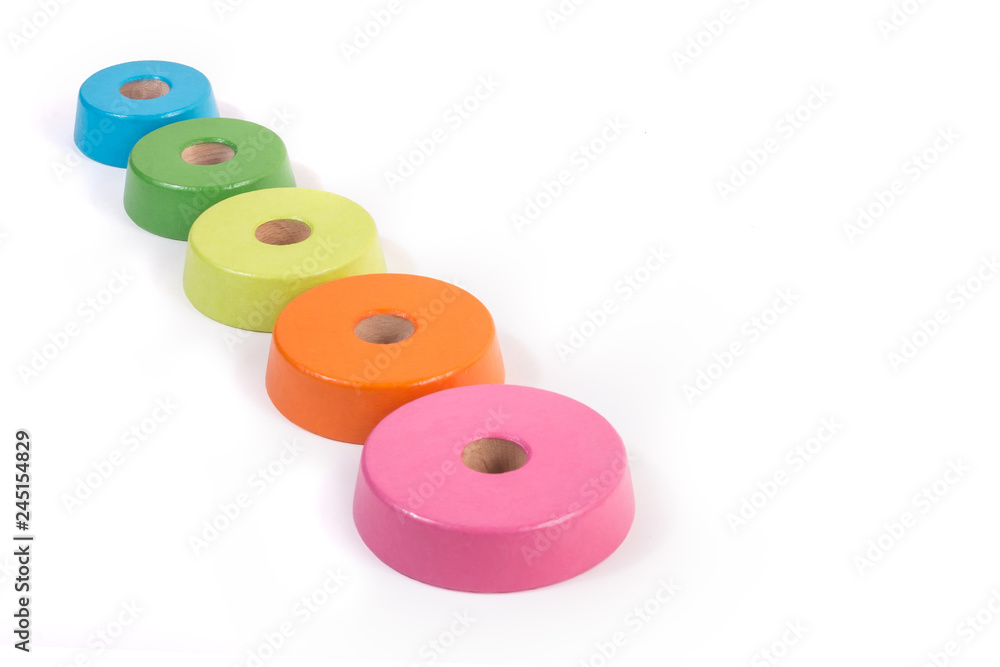 The schedule of children's wooden rings. Increase or decrease circles with different sizes and colors. Chart, list, indicators, enumeration. Place for text. Real business presentation concept. The schedule of children's wooden rings. Increase or decrease circles with different sizes and colors. Chart, list, indicators, enumeration. Place for text. Real business presentation concept.