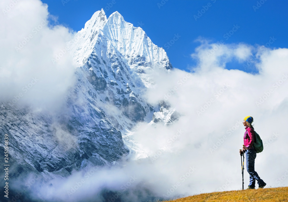 Hiker with backpacks in Nepal. Success freedom and happiness achievement in mountains. Active sport concept.