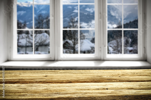 Table background and window of winter landscape 