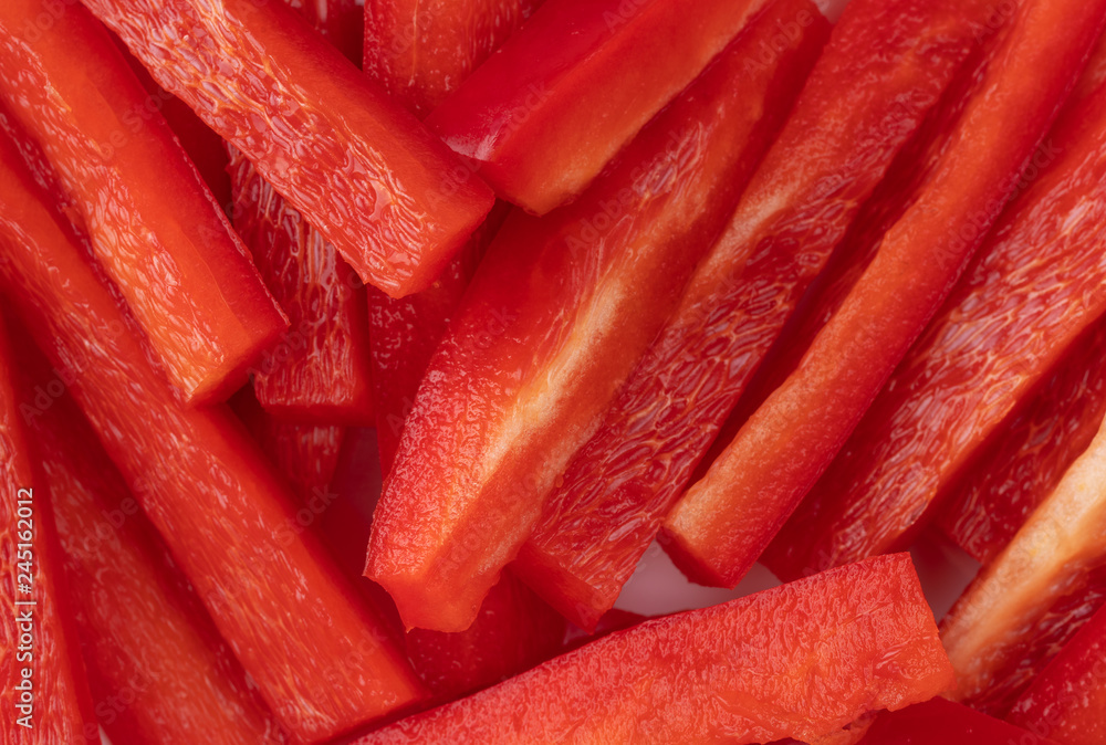 Slices of red bell peppers close view Slices of red bell peppers close view