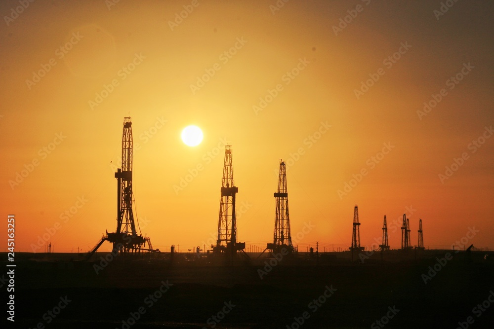The setting sun of Karamay oil field in Xinjiang Uygur autonomous region of China The setting sun of Karamay oil field in Xinjiang Uygur autonomous region of China