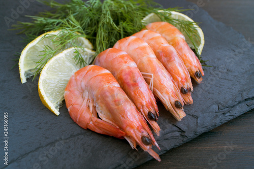 Fresh shrimp blackboard with lemon and dill.
