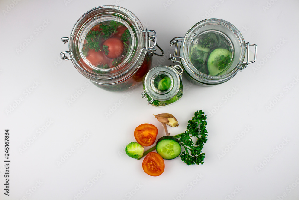 A variety of canned products in glass jars - tomatoes, cucumbers, Brussels sprouts, broccoli. Preservation of vegetables and fruits. canning. Preservation of the harvest. isolate A variety of canned products in glass jars - tomatoes, cucumbers, Brussels sprouts, broccoli. Preservation of vegetables and fruits. canning. Preservation of the harvest. isolate