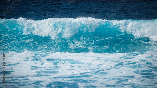 Large turquoise wave in the sea. Lanzarote, Canary Islands.
