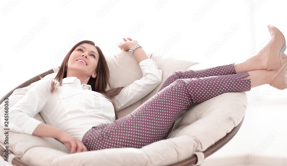 close up.dreaming woman sitting in a comfortable chair close up.dreaming woman sitting in a comfortable chair