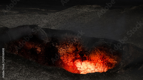 Lava glowing in volcano cra...