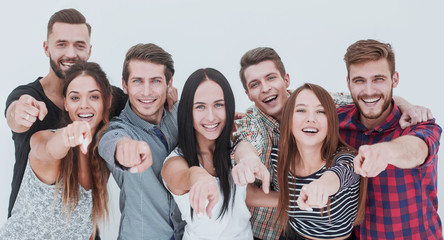 fun team of young people pointing at you