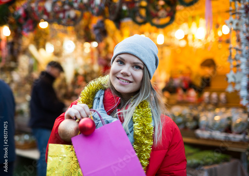 Happy woman on outdoor Christmas market