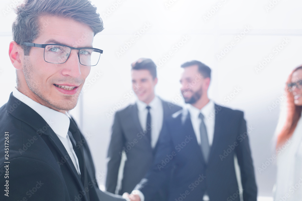 close up.successful businessman standing in the office close up.successful businessman standing in the office