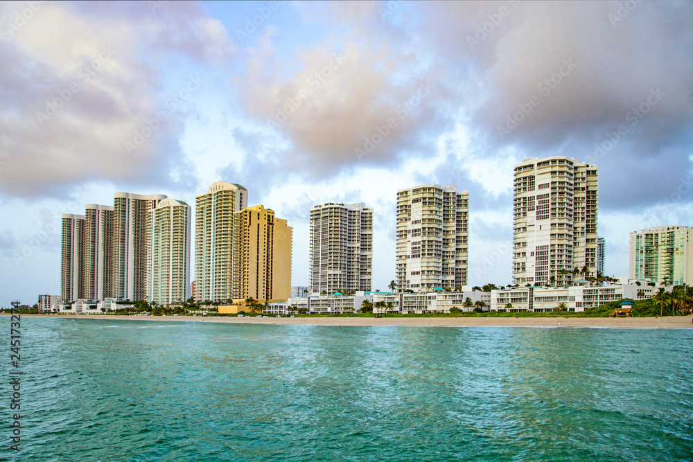 Obraz premium empty beach at Sunny isles beach, Miami in early morning with skyscraper