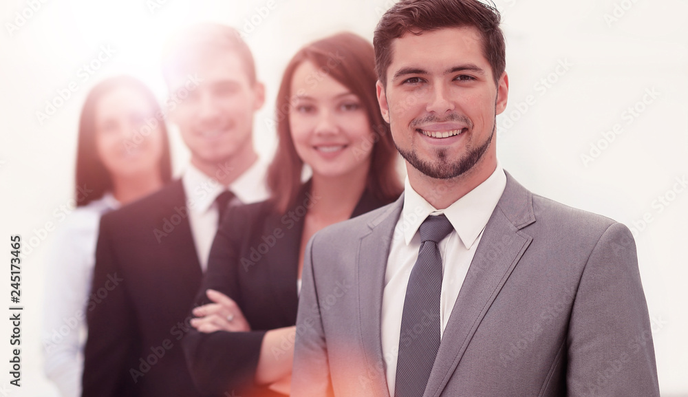 leader and the business team standing one behind the other. leader and the business team standing one behind the other.