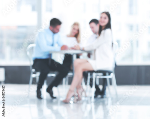abstract blurred group of business people sitting at a table © ASDF