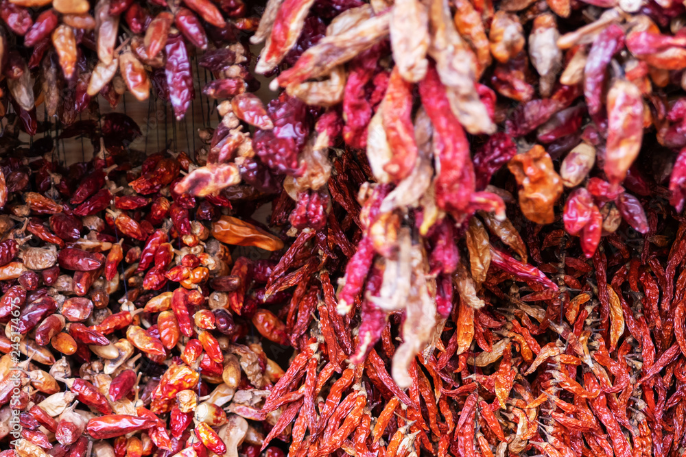 Fototapeta premium Bundles of red chilli peppers. Texture.