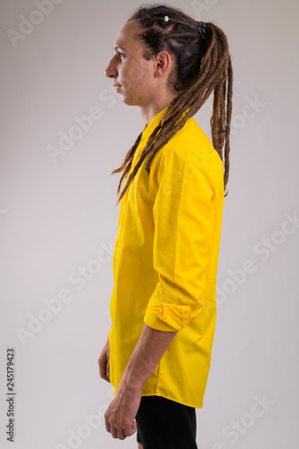 Profile view of young handsome businessman with dreadlocks © Ranta Images