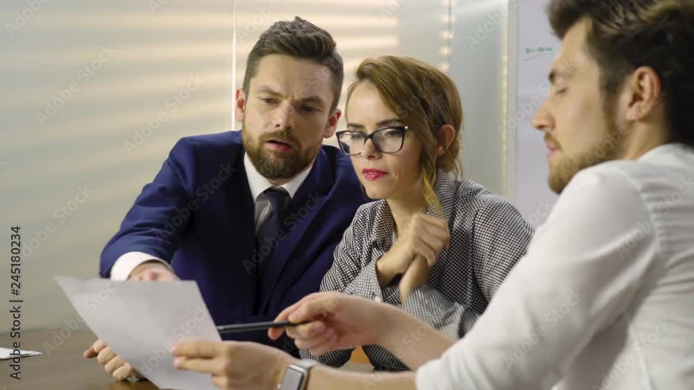 Young corporate employees are discussing business topics. Young corporate employees are discussing business topics.