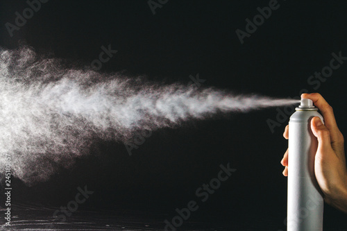 Spraying the aerosol from the spray photo